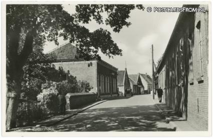 ansichtkaart: Puttershoek, Groeten uit. Raadhuis